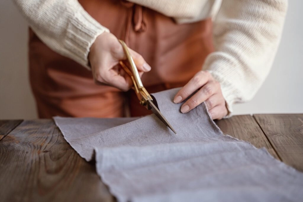 front-view-tailor-cutting-fabric